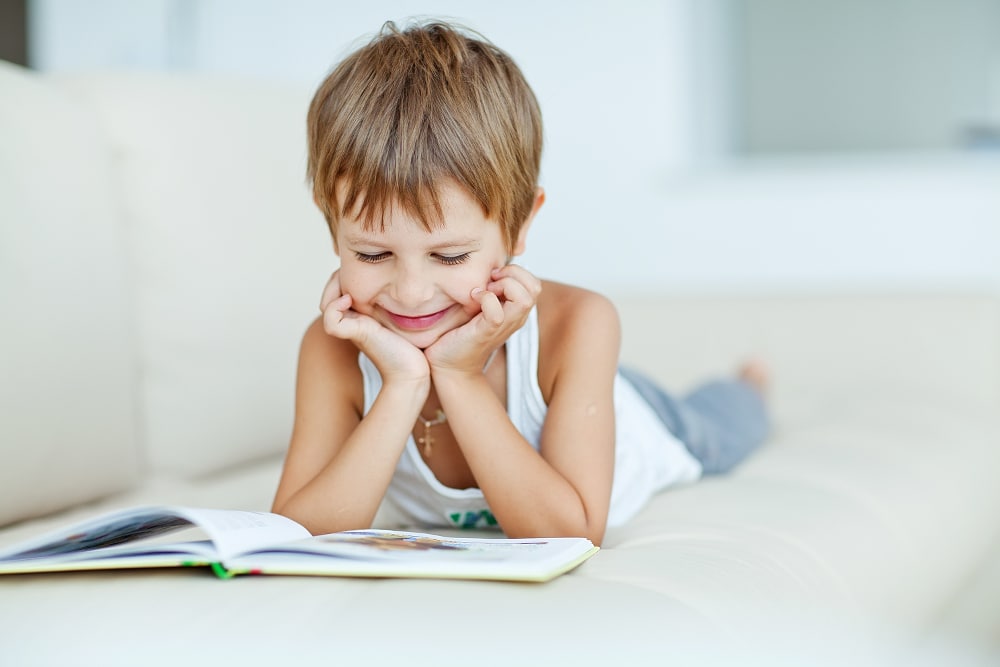 Kid reading on the floor